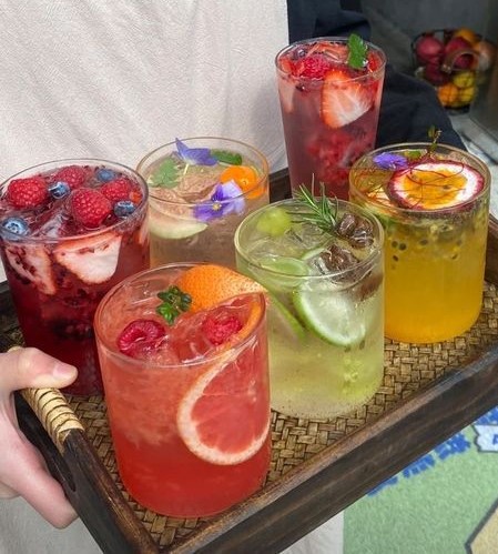 Colorful fresh mocktail with fruit garnish